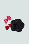 Gancho flor de peluche negro - accesorio elegante y suave